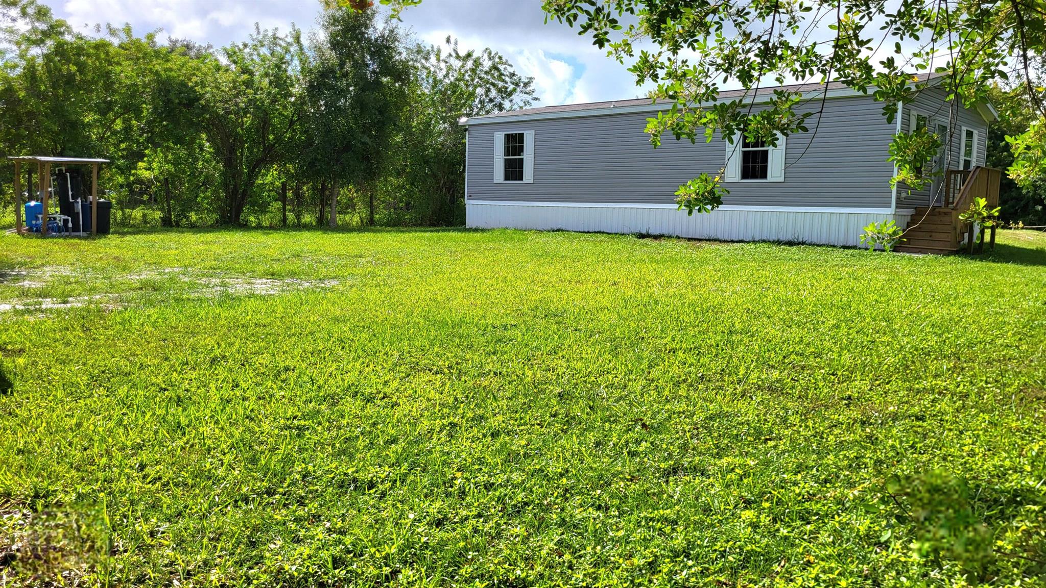 Take in the distant sounds of a rooster as you wake in your brand-new home on nearly a 1/2 acre. The fenced in spacious yard, complete with deep well, water filtration/softener system, rear septic, and partial concrete driveway, offer a blank canvas for your enhancements, landscaping and personal color pallet. Splendid, resilient, seamless flooring throughout. Ideal location near Rt 98 & 70 is a convenient commute to town or the coast. Make PLAYLAND PARK your next homestead. No HOA. No flood zone. No worries knowing this property is easy to finance and insure. Yes, everything is new for you!