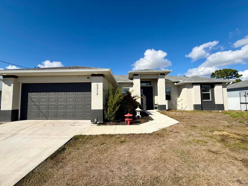Photo of 3312 16th Street W, Lehigh Acres, FL 33971 (MLS # R11164569)