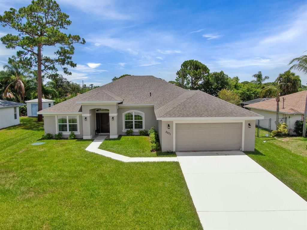Photo of 2071 SE Benedictine Street, Port St Lucie, FL 34983 (MLS # R10882590)