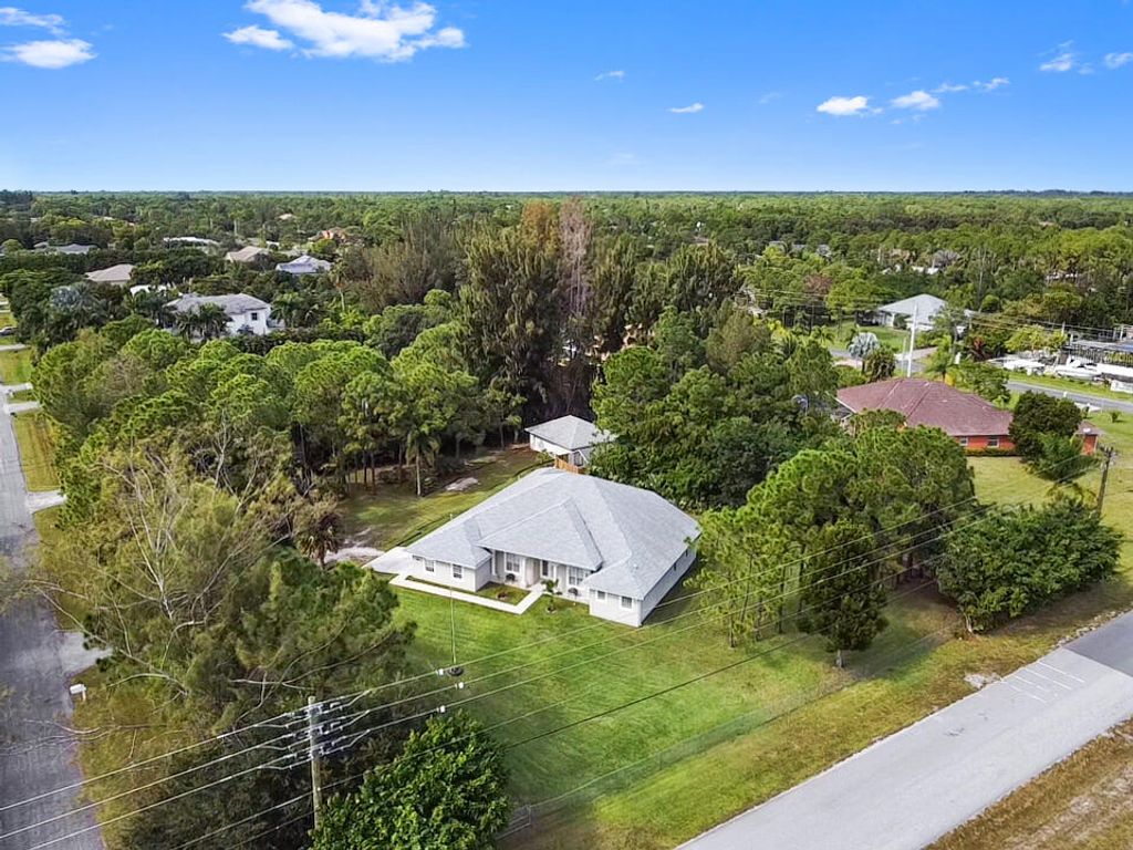 Photo of 12037 70th Place N, West Palm Beach, FL 33412 (MLS # R10934781)