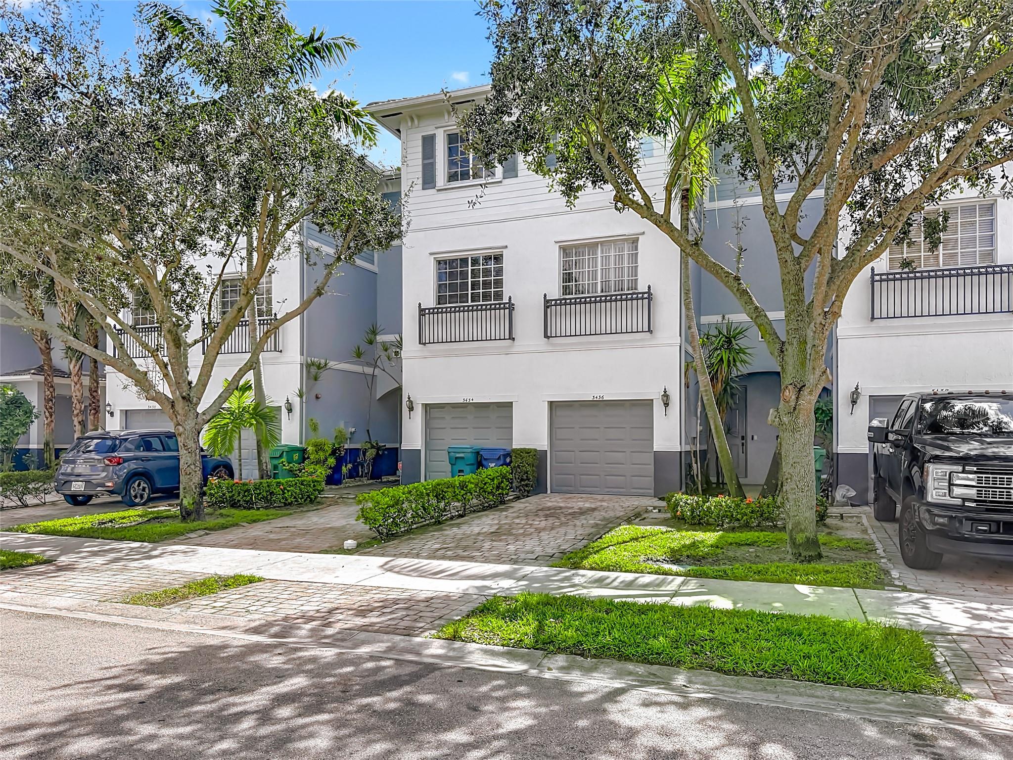 FHA-approved tri-level townhome in gated Cassa at Georgetown. 3 bedrooms, 2.5 baths, and a 1-car garage. Second floor features a spacious primary suite with two walk-in closets, double vanity, walk-in shower, and soaking tub. Top floor includes two bedrooms, a full bath, and laundry room with new washing machine and dryer. New appliances and a convenient half bath on the first floor. Community amenities include pool, basketball court, clubhouse, splash pad, and playground. Dog-friendly with no restrictions. Current loan is assumable at 6.2%. Perfect for families or professionals seeking space and convenience.