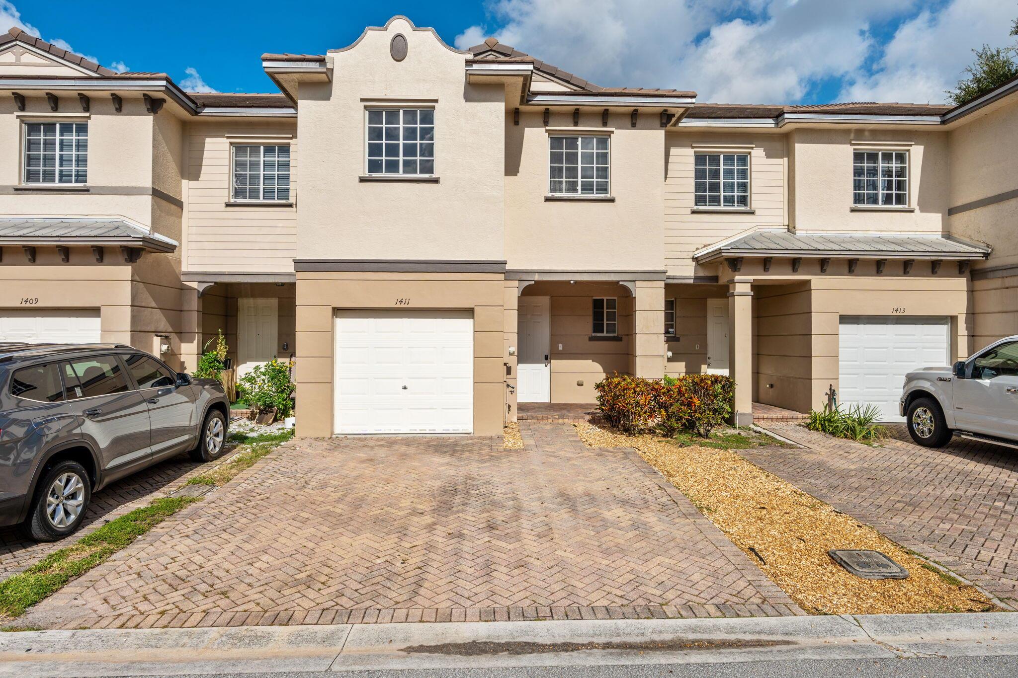 Welcome to this beautifully updated & move-in ready townhouse located in a privately gated community in the heart of Palm Beach County. Just minutes from world-renowned beaches, top shopping, dining, and easy access to major highways, this spacious residence offers the perfect blend of luxury & convenience. Boasting 3 generously sized bedrooms, 2.5 bathrooms, a one-car garage, and two covered porches, this home features a large open layout ideal for both relaxing & entertaining. Upstairs, enjoy the added bonus of a spacious loft perfect for a home office or second living space along with a convenient laundry room. Resort-style amenities include a sparkling pool, clubhouse, fitness center, spa, playground, basketball court, & tennis courts. Experience the best of South Florida living!
