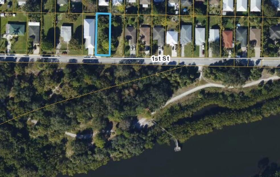 Terrific opportunity to purchase a residential building lot in Jupiter for under $200k. Across the street from a Jupiter Natural area with fitness paths along the Loxahatchee River. No homes across the street makes this lot special. Beautiful mature trees, easy access to I-95 and the turnpike! Less than 15 minutes to Jupiter Beaches, dining, shops and more.