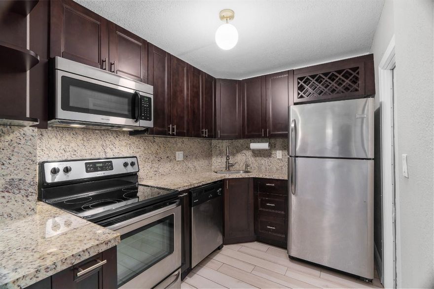 Located on the ground floor this one-bedroom home is surprisingly spacious. Offering an updated kitchen with stainless steel appliances, nicely renovated bath with a bidet, tile flooring, and new impact glass.  Enjoy the wonderful amenities including a clubhouse and heated pool. Convenient laundry room, lockable storage and assigned parking. Located just 5 minutes from exciting bars, shops and restaurants on Wilton Drive.  Many of the photos are virtually staged to show decorating options. Purchaser must have minimum credit score of 650. Cats allowed as are service animals.   NOTE: this unit has a land lease.