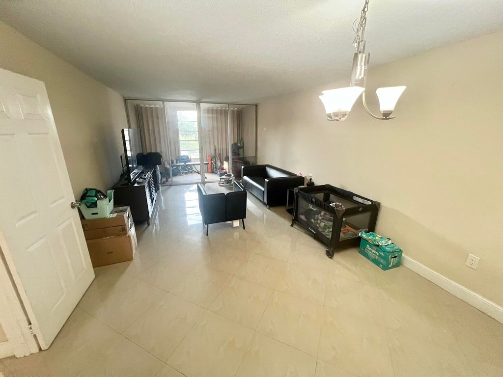 Photo of 9430 Tangerine Place #202, Davie, FL 33324 (MLS # B26007444)