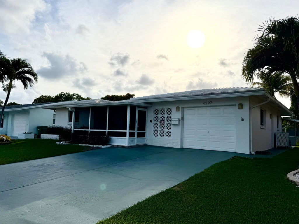 Photo of 4927 NW 47th Terrace, Tamarac, FL 33319 (MLS # B26046460)