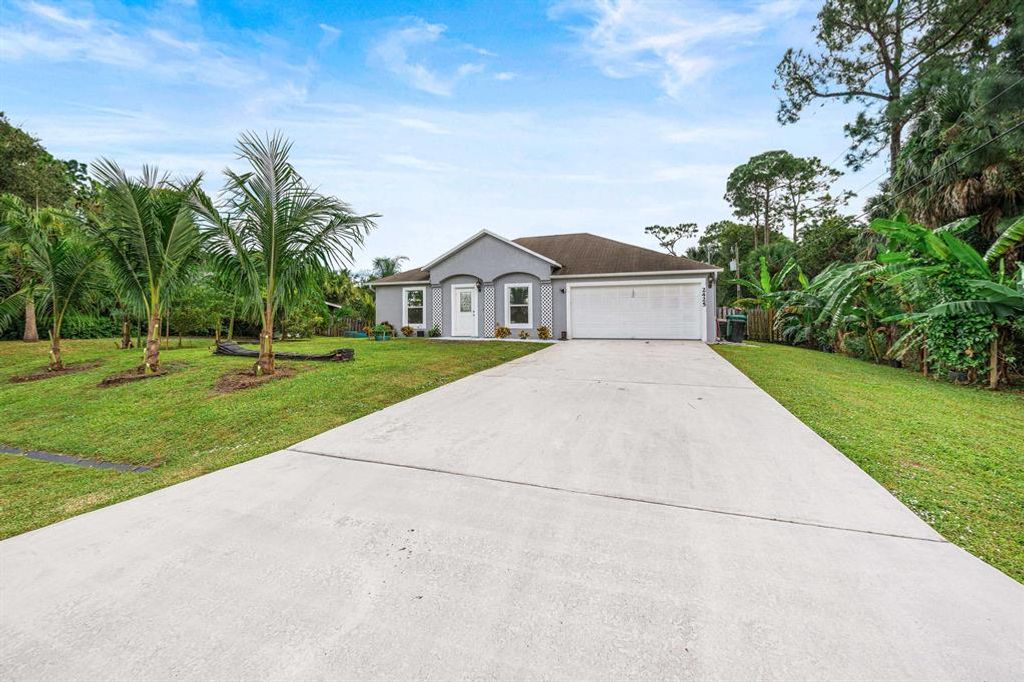 Photo of 2425 SW Polk Court Ct, Port St Lucie, FL 34953 (MLS # R10757128)