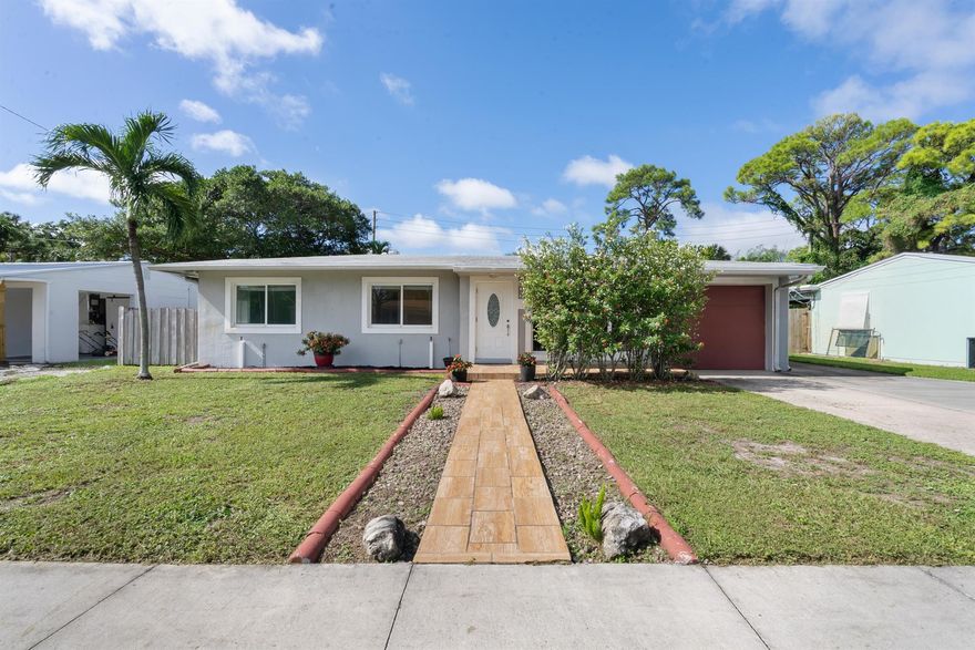 Enjoy Florida living in this charming 3-bedroom, 2-bath home just 1 block from beautiful Lake Osborne! Featuring an open floor plan, screened porch, and a fully fenced backyard with plenty of room for a pool, this home is perfect for entertaining. Recent updates include a 2017 roof and upgraded electrical panel for added peace of mind. A separate utility room with washer/dryer and a 1-car garage provide everyday convenience, while no HOA means flexibility and freedom. Inside, natural light flows throughout, highlighting the spacious living areas. Step outside to your huge backyard oasis--ideal for gatherings, gardening, or creating your dream outdoor retreat. With its prime location near the lake, this home combines comfort, style, and convenience in one unbeatable package.