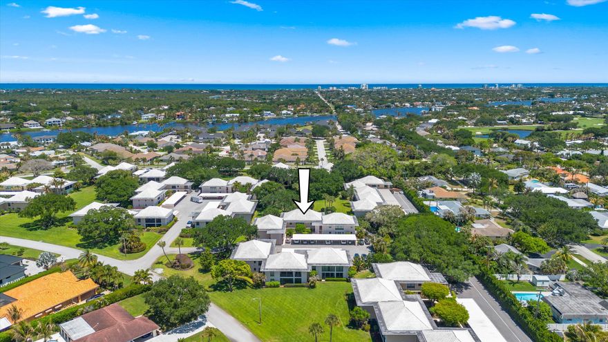 Welcome to easy Florida living in desirable Turtle Creek in Tequesta. This spacious 2-bedroom, 2-bath condo offers approximately 1,400 square feet of living space with a bright, open layout and split-bedroom floor plan. The updated kitchen includes white cabinetry, sleek countertops, and newer appliances. The open living and dining areas provide ample space for relaxing or entertaining, with large windows bringing in abundant natural light. All rooms offer access to a large glass-enclosed and screened lanai overlooking peaceful garden views—perfect for enjoying the outdoor setting year-round. The primary suite features a walk-in closet, ensuite bath, and direct lanai access. The guest bedroom includes a double closet, garden views, and access to the lanai. SEE MORE... Additional highlights include large closets throughout for ample storage, a carport, and additional open parking.  Located within the gated Turtle Creek golf community, residents enjoy amenities including a community pool, sauna, clubhouse, BBQ area, and bocce ball court. Optional golf memberships may be available at nearby Turtle Creek Country Club and Tequesta Country Club.  Conveniently located close to beaches, shopping, dining, and Palm Beach International Airport, this property offers comfort, convenience, and a relaxed Florida lifestyle.