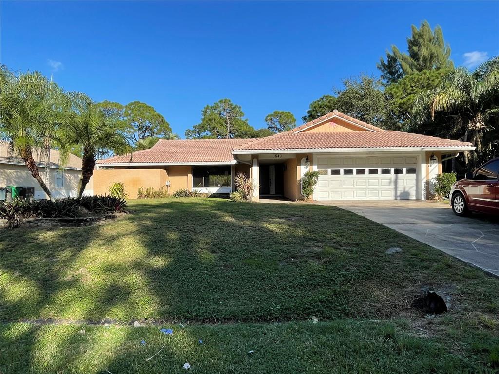 Photo of 1649 SW Taurus Ln, Port Saint Lucie, FL 34984 (MLS # F10313501)