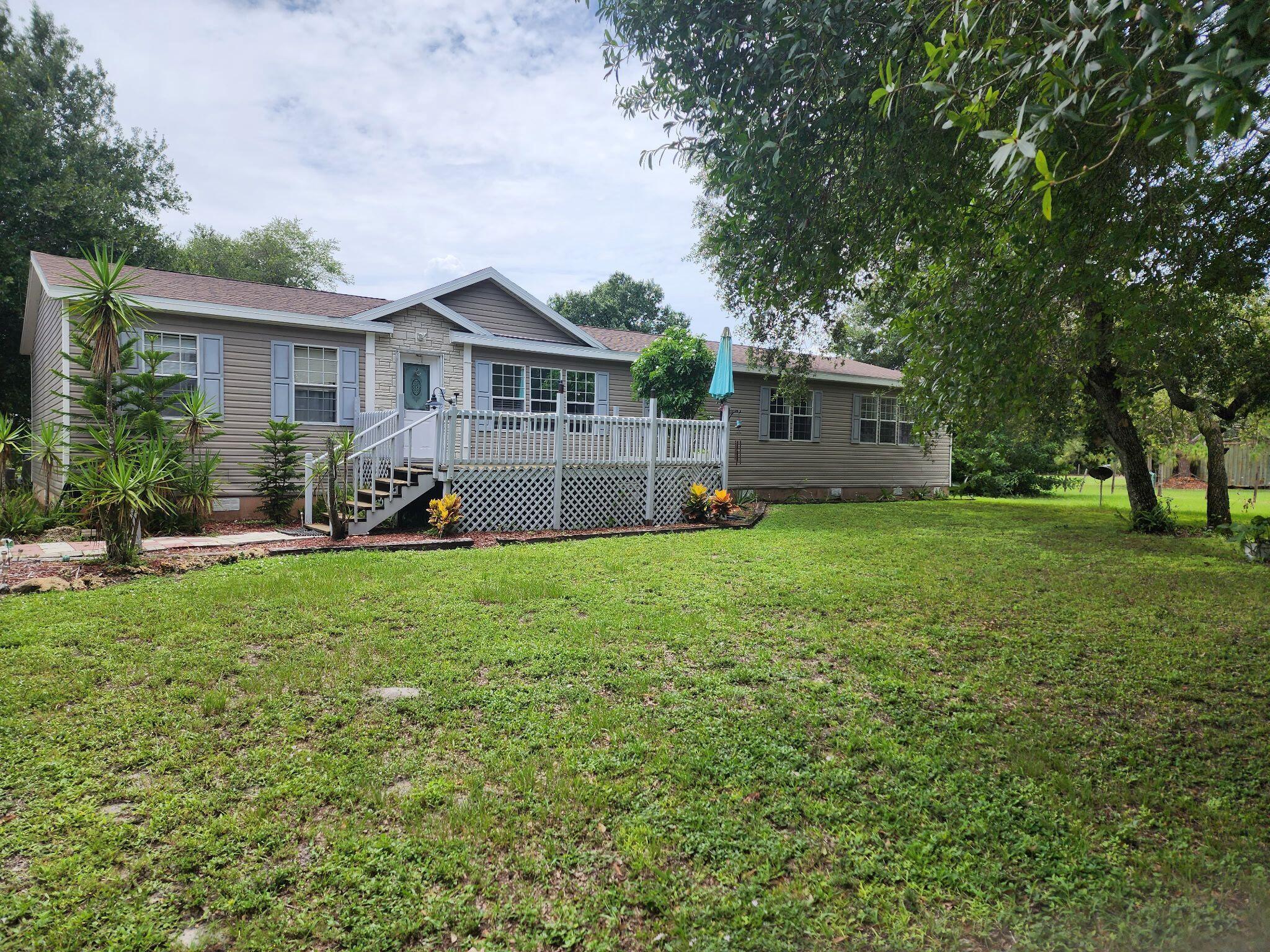 This spacious home on 1.25 acres offers the perfect mix of comfort, style, and peaceful country living. With four bedrooms and two bathrooms, it's ideal for a growing family or anyone who needs extra space for guests. A welcoming wood deck leads you inside, while the back patio overlooks a pristine pool and hot tub--great for relaxing or entertaining. The open kitchen is both functional and inviting, perfect for gathering. Outside, you'll find a shed and carport for extra storage and parking. A tranquil pond in the backyard adds to the serene setting. The primary suite features a walk-in closet, garden tub, and a separate shower for a true retreat. All furniture shown stays.
