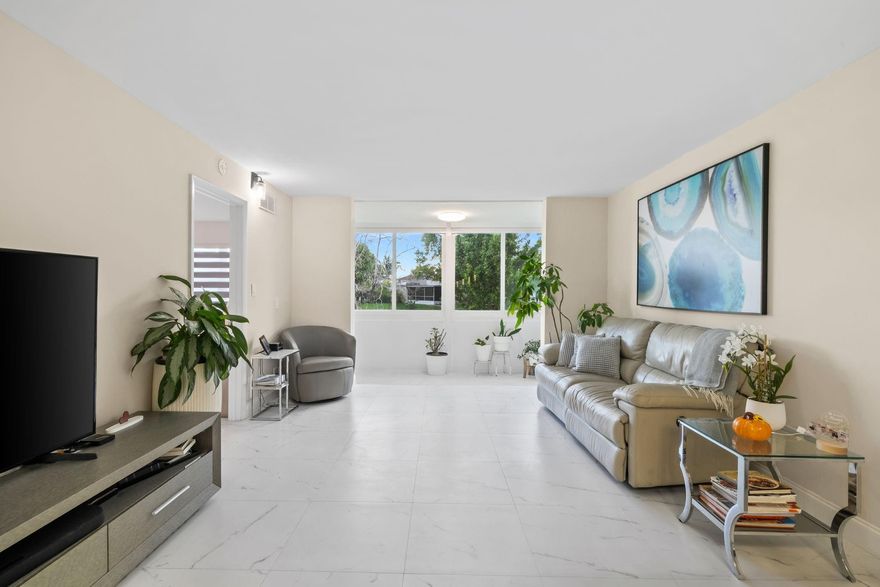 Easy to show!!! Beautiful, fully remodeled, featuring 2 spacious bedrooms and 2 modern bathrooms. 1st floor unit in the desirable Sunrise Lakes, 55+ community.  Move-in ready, new flooring, new kitchen, new bathrooms, 2025 AC,  and ALL IMPACT WINDOWS AND FRONT DOOR. This unit offers serene water view, bright living area, with resort-style amenities including golf, gym, pools, tennis and more!