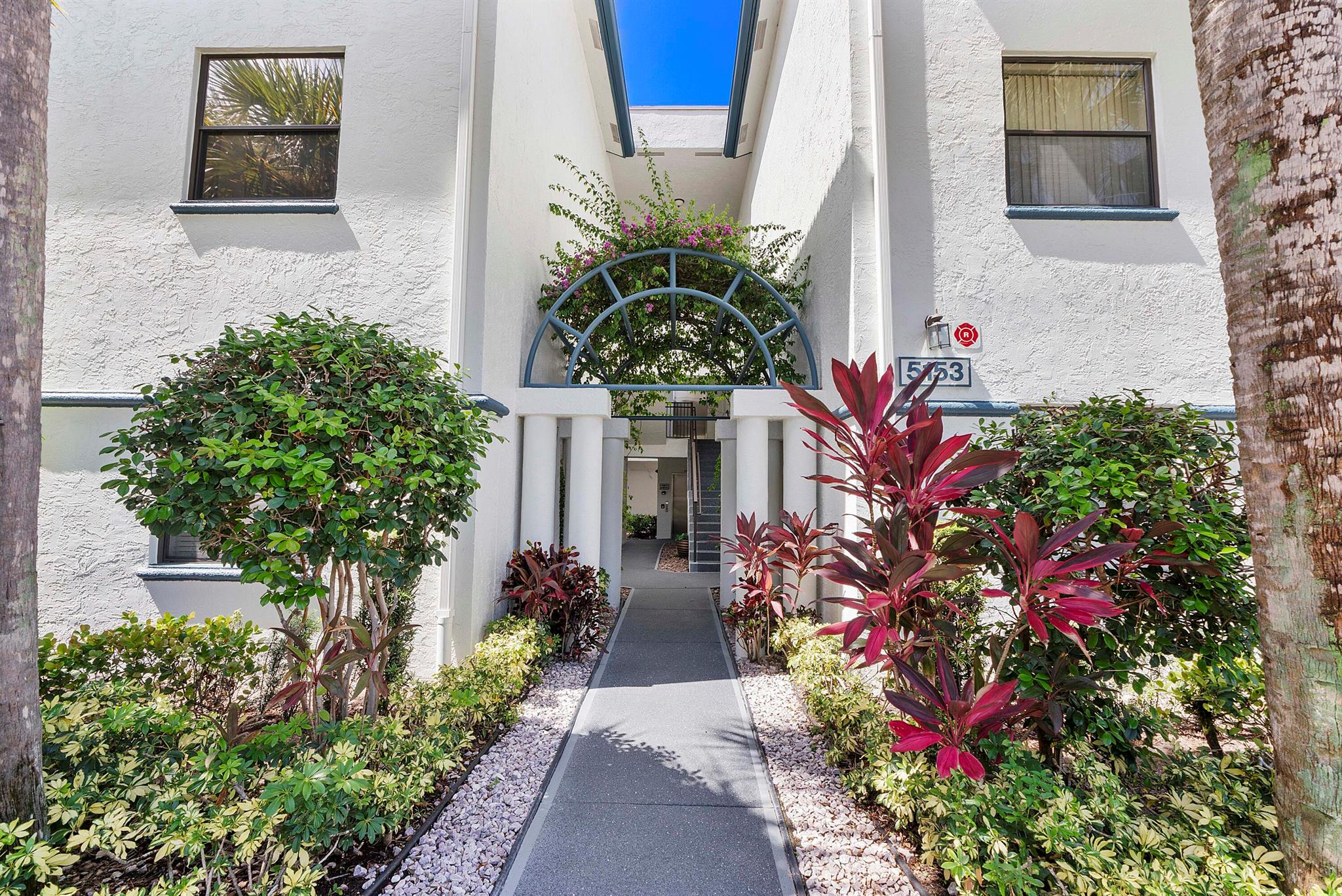 Soak in stunning lake views from every room in this top-floor, elevator-access condo--offering unmatched privacy with no upstairs neighbors! This spacious 3-bed, 2-bath home in Platina's desirable Illustre Village is bathed in natural light and features an open-concept layout perfect for relaxing or entertaining. Step onto your screened balcony and enjoy the best lake views in the building. The split-bedroom plan adds privacy, while vaulted ceilings and a bright eat-in kitchen enhance the airy vibe. Full-size washer/dryer, plenty of storage, and resort-style amenities: pool, cafe, theater, pickleball, gym, and more--without country club fees! Don't miss your chance to live above it all.