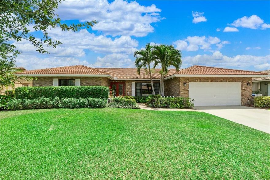 THIS is the one you've been waiting for!  There are so many upgrades: freshly painted exterior, newer washer & dryer, a/c, sprinkler pump, pool pump, impact windows, & 2014 roof. Open floorplan with separate living, dining and family rooms, & a spacious kitchen. The 3 sliding glass doors, plus skylights, bring in a ton of natural light. The well-appointed master bedroom offers a walk-in closet, slider access to the pool area, a master bath with two vanities, tub & separate shower.  Enjoy the outdoors while relaxing on your large, fully screened in patio that overlooks the pool & canal. Want more? How about full hurricane protection, no HOA, & a 10 minute walk to Cypress Parks!