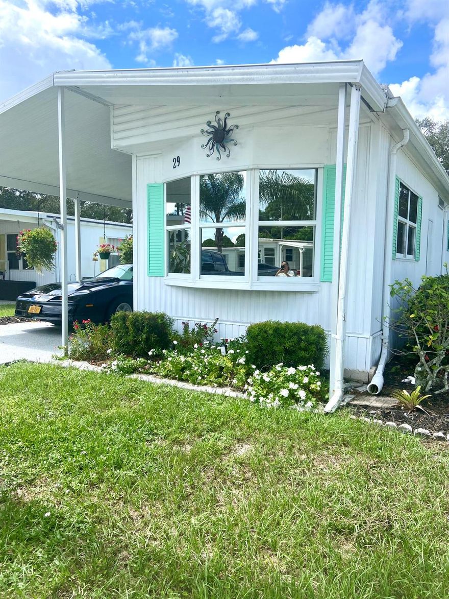 Can you imagine viewing the sunsets from your own back door in this well-appointed 2-bedroom 2 bath home with a fantastic Florida room? The master has a private en suite and is being offered fully furnished. (piano and artwork do NOT remain.) There is a private guest suite and additional bath at the opposite end of this home. The galley kitchen is updated with stainless steel appliances and pull-out shelves for the persons who love to cook and lots of entertaining spaces for your fortunate guests. Current residents will be leaving many household items for the new owners.  The Central air unit was replaced 5 years ago, and the water heater is just 2 years old, impact windows with tint! So, if turnkey sounds like an option for you then call me today to schedule your private showing!