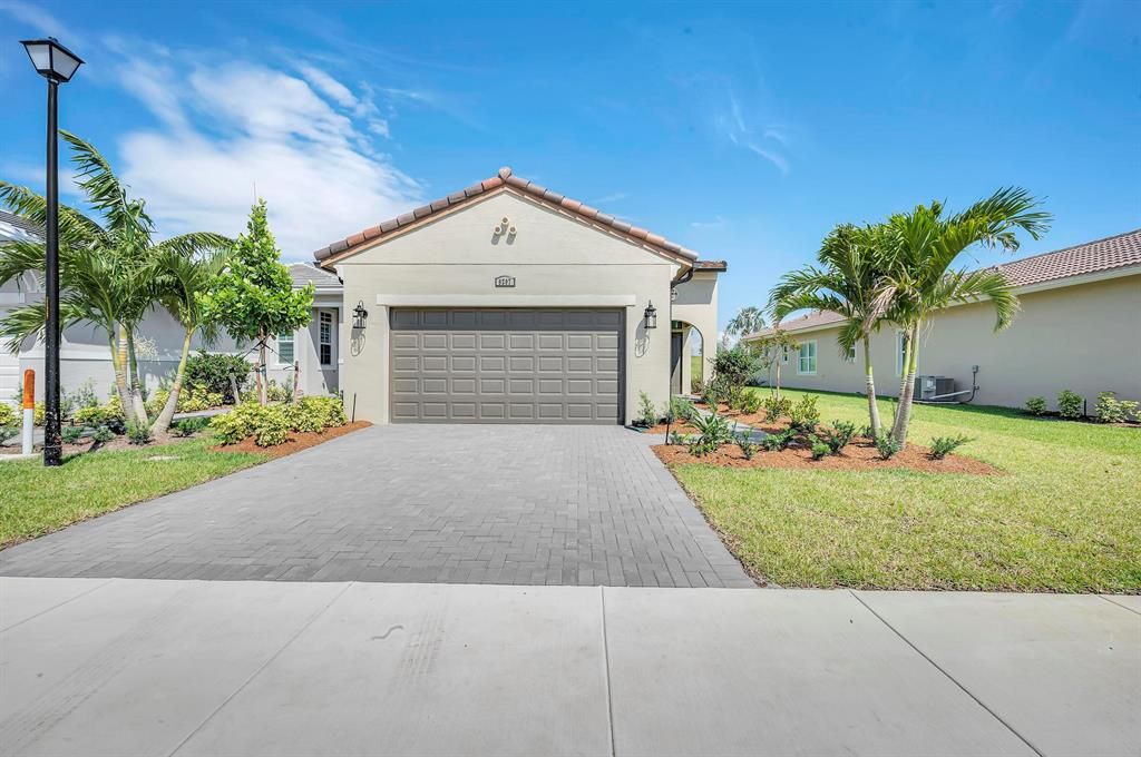 Photo of 9207 SW Pepoli Way, Port St Lucie, FL 34987 (MLS # R10885993)