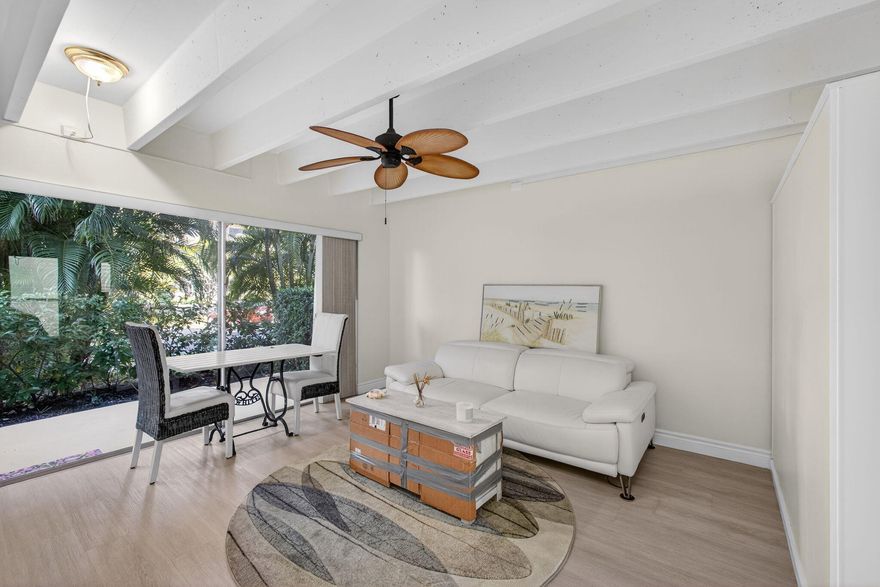 Consistent flooring, great natural lighting & an updated bathroom are among the features to enjoy at this ground floor studio at Tropicana Gardens in South Palm Beach. Convenient access with entryways on both sides of the unit. Great greenery surrounds the patio entrance, which has a private paved path from the parking lot. The assigned parking spot is directly across from the patio. A separate, large storage locker comes with the unit. Tropicana Gardens is past Milestone Inspections & fully reserved. The 55+ community is serene & quiet, highlighted by a heated pool on the Intracoastal. The building is in a fantastic location with proximity to Lantana Beach, Dune Deck Cafe, The Eau Resort, Publix-anchored Plaza del Mar Shopping Center & Lantana Nature Preserve.