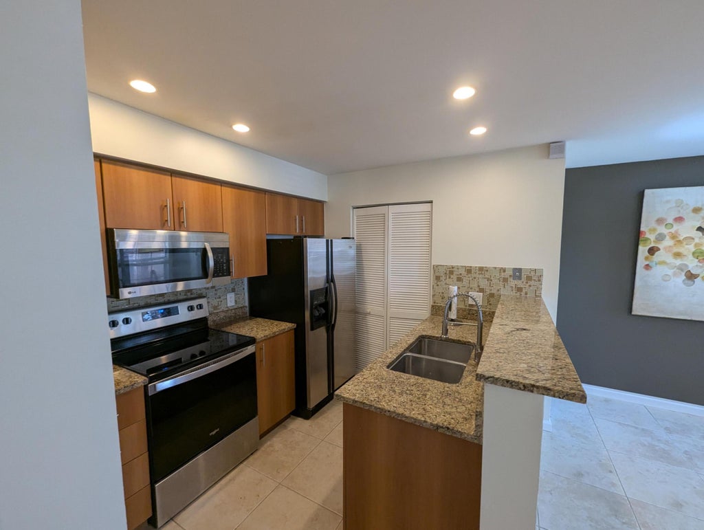 Photo of 1335 Crystal Way #E, Delray Beach, FL 33444 (MLS # B26030773)