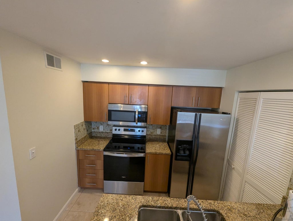 Photo of 1335 Crystal Way #E, Delray Beach, FL 33444 (MLS # B26030773)
