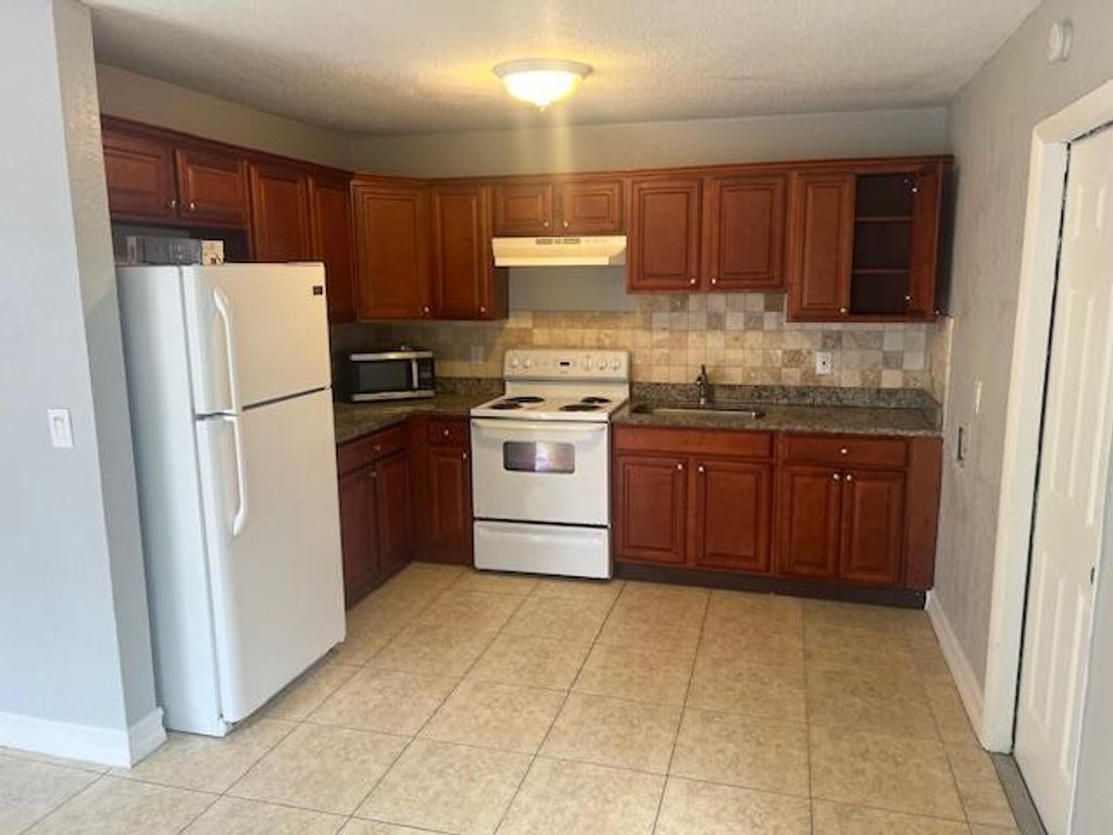 Photo of 1645 NE 3rd Avenue, Delray Beach, FL 33444 (MLS # R10970966)