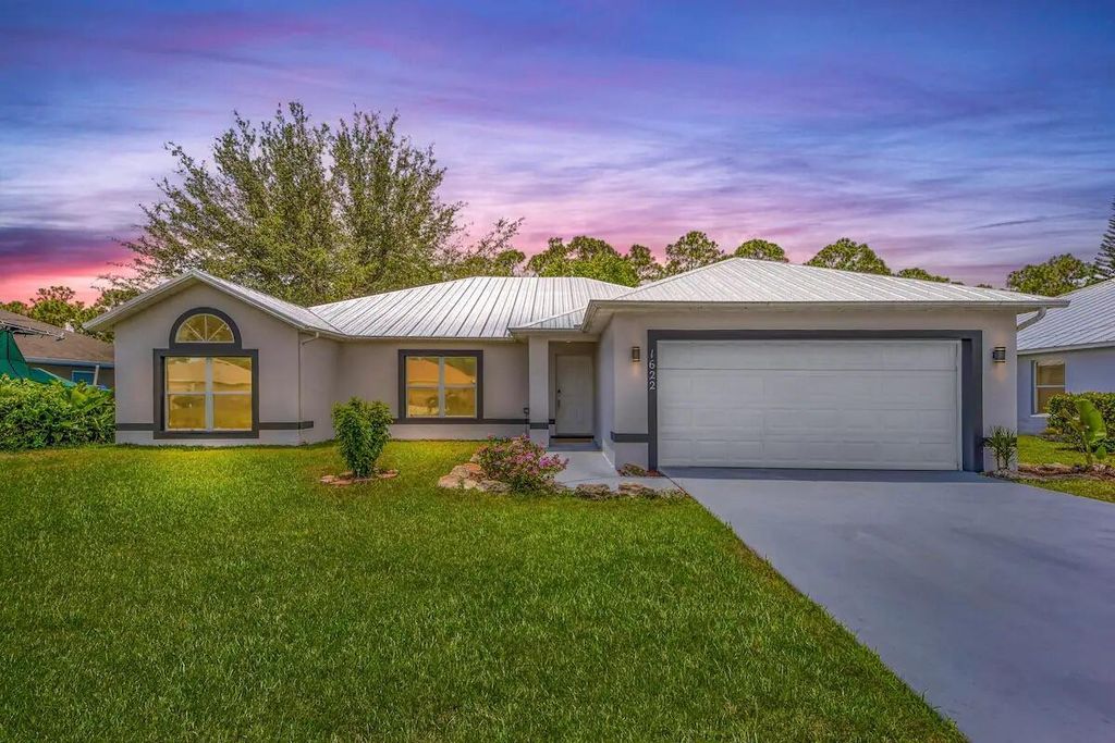 Photo of 1622 SW Lofgren Avenue, Port Saint Lucie, FL 34953 (MLS # R10903843)