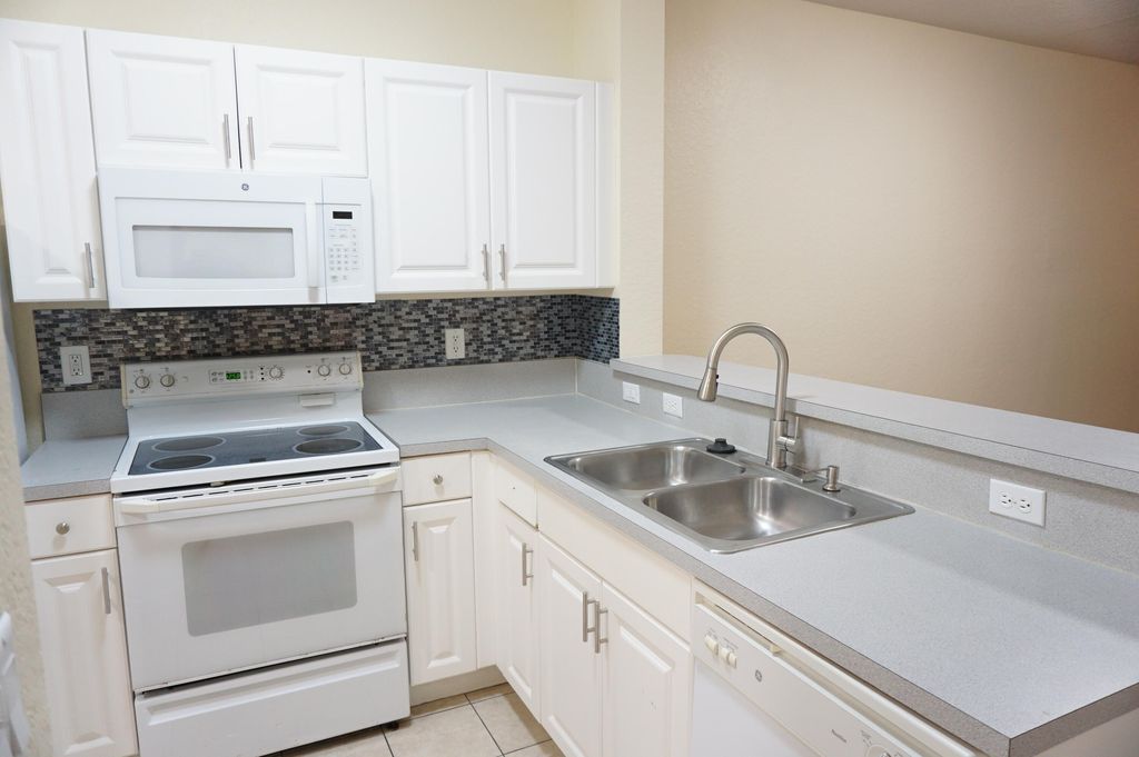 Photo of 1933 Hibiscus Lane, Riviera Beach, FL 33404 (MLS # R10946977)