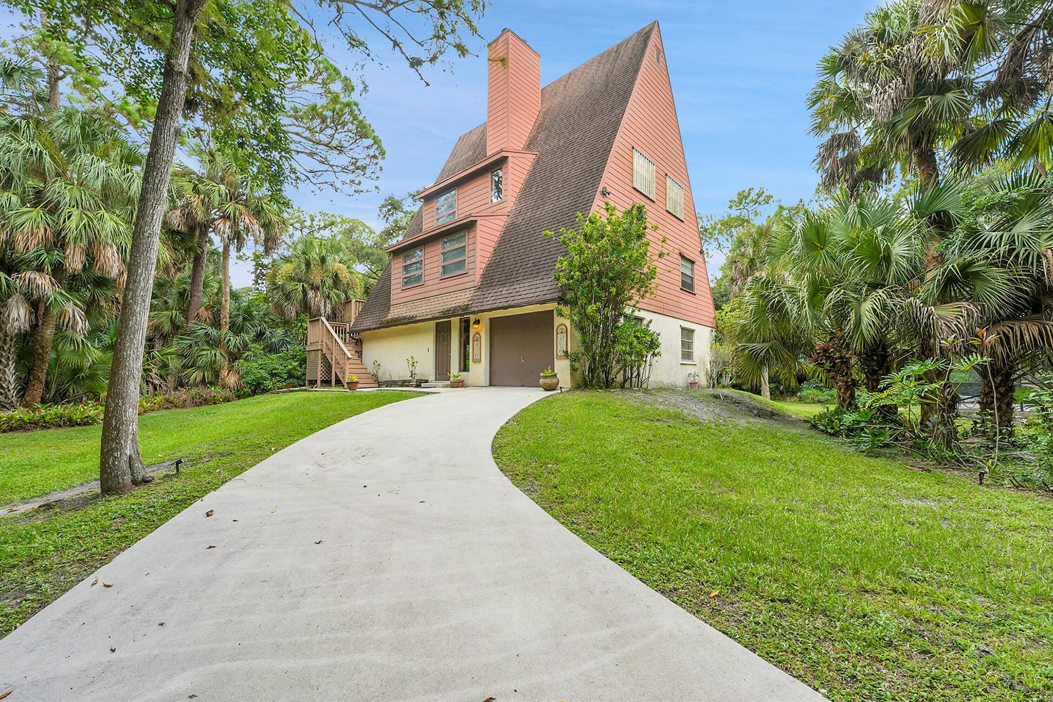 A Rare Jupiter Farms Gem!This unique three-story, four-bedroom, 2.5-bath home sits on 1.25 acres of privacy and charm. Featuring spacious rooms, soaring ceilings, and two cozy fireplaces, this home is full of character. Enjoy the screened-in private pool surrounded by mature trees, creating a true retreat atmosphere. The oversized lot provides plenty of space for boats, RVs, and all your toys. With its secluded setting and natural beauty, this property offers the perfect balance of tranquility and convenience--ideal for those seeking both comfort and lifestyle in the heart of Jupiter Farms.Optional Adjacent Lot AvailableAn additional 1.25-acre lot located directly next to the property is also available for purchase separately. This offers buyers the unique opportunity to expand their