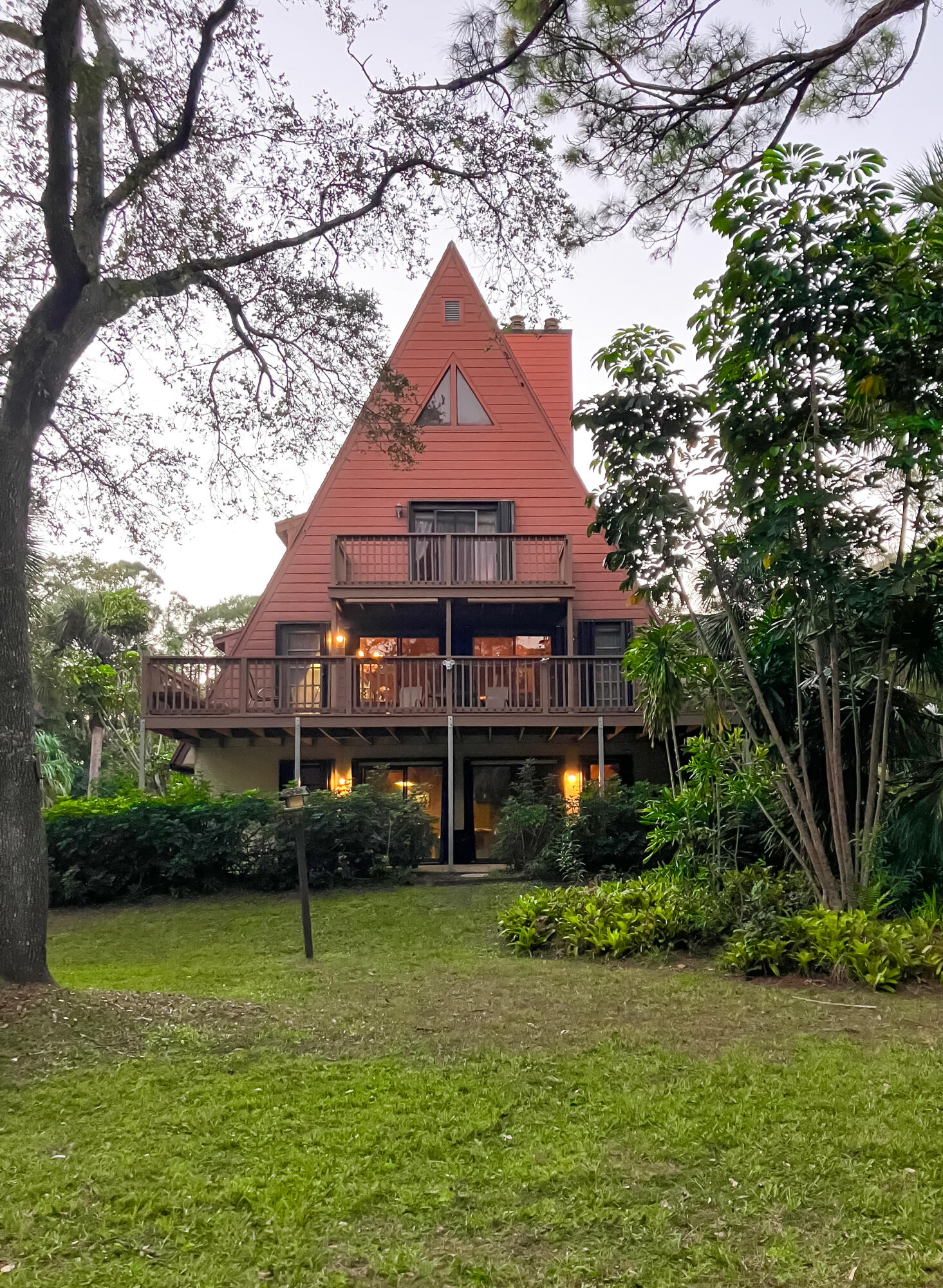 A Rare Jupiter Farms Gem!This unique three-story, four-bedroom, 2.5-bath home sits on 1.25 acres of privacy and charm. Featuring spacious rooms, soaring ceilings, and two cozy fireplaces, this home is full of character. Enjoy the screened-in private pool surrounded by mature trees, creating a true retreat atmosphere. The oversized lot provides plenty of space for boats, RVs, and all your toys. With its secluded setting and natural beauty, this property offers the perfect balance of tranquility and convenience--ideal for those seeking both comfort and lifestyle in the heart of Jupiter Farms.Optional Adjacent Lot AvailableAn additional 1.25-acre lot located directly next to the property is also available for purchase separately. This offers buyers the unique opportunity to expand their