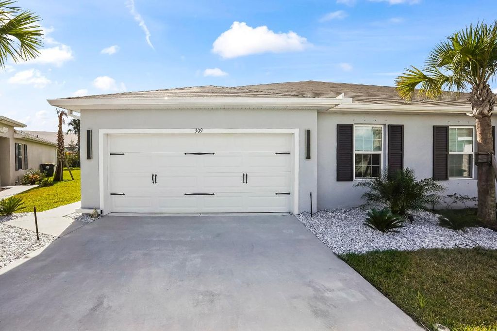 Photo of 309 Raspberry Road, Fort Pierce, FL 34981 (MLS # R11147946)