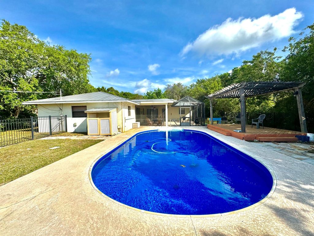 Photo of 1499 NE 29th Terrace, Jensen Beach, FL 34957 (MLS # R10942282)