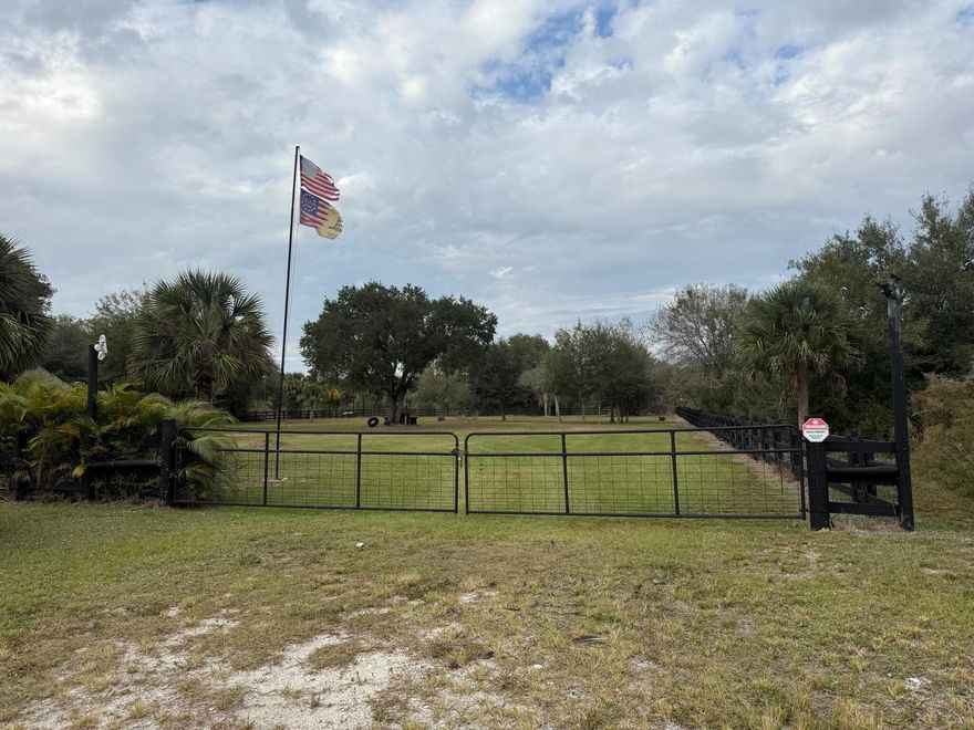 Welcome to your perfect weekend retreat or full-time country escape! This beautifully improved Okeechobee property is fully equipped and ready for your RV, toys, and outdoor living lifestyle. The lot is cleared, fenced, and gated, offering privacy and a true park-like setting complete with benches and mature shade. Featuring two well pumps, septic, and power on site, this parcel provides everything needed for immediate use. Enjoy the spacious large tiki hut and impressive outdoor kitchen with a wood-burning oven, ideal for entertaining and relaxing with family and friends. Property also includes a culvert, RV hookups, a shed with a full bathroom, plus an additional storage shed for tools and equipment.