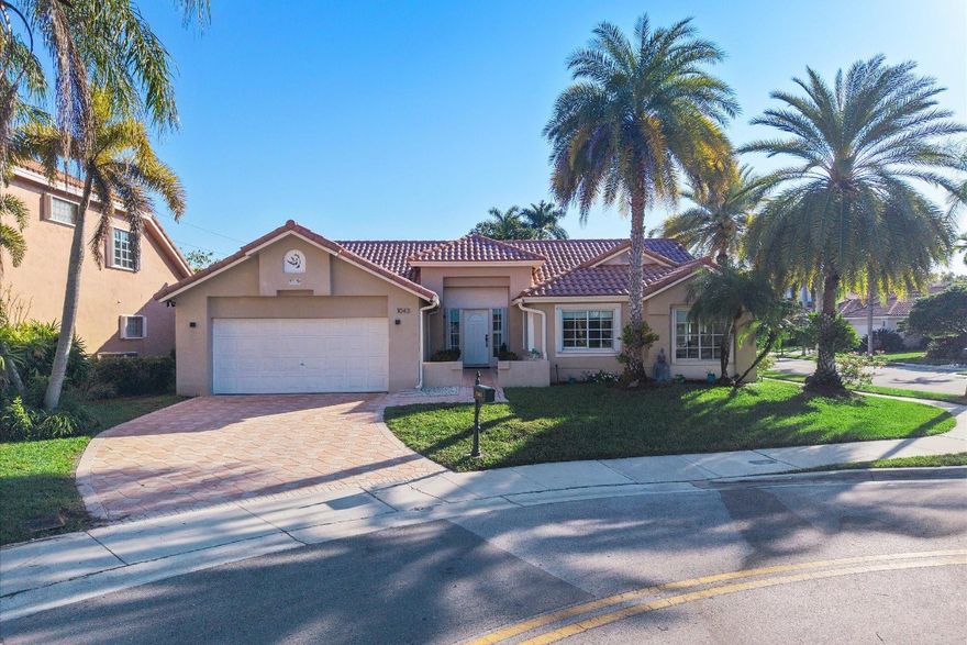 Located in the gated community of Laguna Springs in the City of Weston, this beautiful 3-bedroom, 2-bath single-story home offers comfort, space, and charm. Set on a desirable corner lot, the home features ample living areas, vaulted ceilings, and an open kitchen with granite countertops and stainless-steel appliances. Enjoy a screened patio, paved driveway, 2-car garage, and durable S-tile roof. Baths have been tastefully updated. Laguna Springs is an intimate enclave of 142 single-family homes, highlighted by palm tree–lined streets and excellent amenities including a community pool, basketball court, and cabana clubhouse, providing inviting spaces for residents to gather and relax. A wonderful opportunity to enjoy the Weston lifestyle in a secure, well-kept community. Accordion Shutters