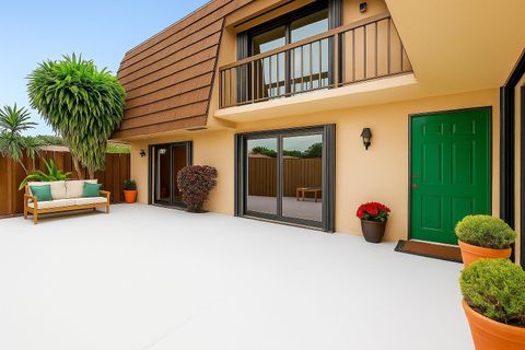 Photo of 9 Atrium Circle #A, Atlantis, FL 33462 (MLS # B26037409)