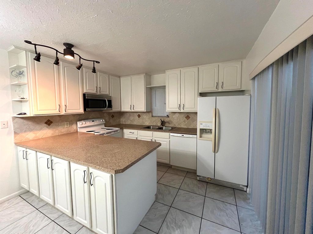 Photo of 5502 Waterview Circle, Palm Springs, FL 33461 (MLS # R11095285)