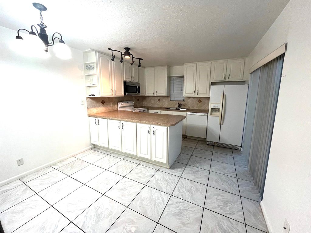 Photo of 5502 Waterview Circle, Palm Springs, FL 33461 (MLS # R11095285)