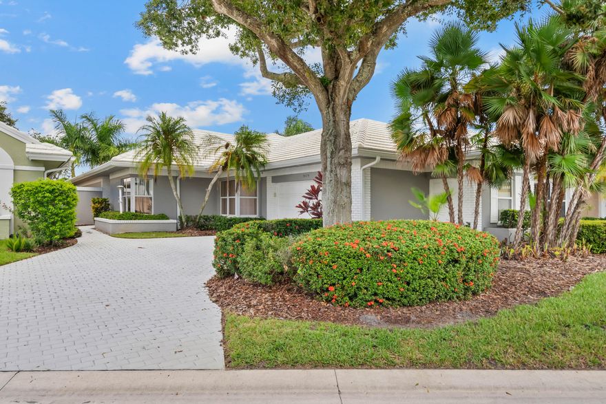 Spacious, light-filled Expanded Whitehall model with a spectacular panorama of Monarch Country Club's championship 15th fairway. A charming brick-paver courtyard sets the tone, leading into a great room with tray ceiling, and double French doors that open to the enclosed Florida room--ideal for morning coffee or sunset cocktails with sweeping golf views. The primary suite features its own French doors to the Florida room, an oversized walk-in closet, and a spa bath with Roman shower, soaking tub, and dual-sink vanity. A private guest wing offers two generous bedrooms and a large full bath. One bedroom is a flexible office/guest room outfitted with a Murphy bed, built-in shelving, and a desk.