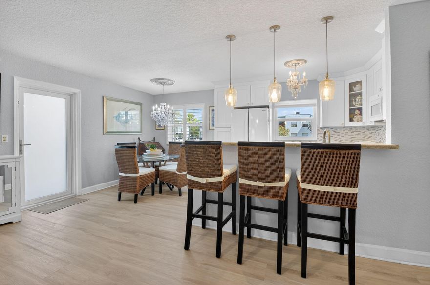 BEAUTIFULLY remodeled first floor, 2 bed 2 bath condo in the sought after 55+ community of Kings Point in Delray Beach FL. . Open concept kitchen with recessed lighting, granite countertops,  and fresh white cabinets. Impact windows in the kitchen, dining, livingroon and 1 BR.  Updated electrical panel. The enclosed patio includes a washer & dryer with additional storage and faces a water view.  Assigned parking is steps away from your front door! Flanders clubhouse with a restaurant and a large pool and locker room and meeting room is within walking distance!  The main clubhouse offers an exercise room with a vast array of equipment, sauna, locker room,  free bus service, a state of the art theater, card & billiard rooms, library, and a large selection of clubs and scheduled activities.