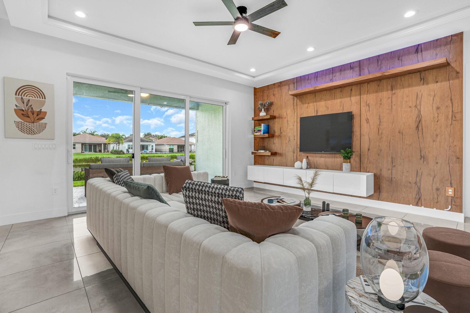 2018 single-story Barcelona model in the resort-style gated community of Dakota. This 4 bed, 3 bath home features tile & luxury vinyl flooring, and a split floor plan with one bedroom offering an ensuite—perfect as a second master. The spacious living room is filled with natural light & features a sleek media wall with serene lake views. Step outside to a generously extended paved patio and a sizable side yard, perfect for outdoor entertaining. Enjoy peace of mind with full-impact windows and doors, a whole-home generator hookup with surge protection, and a brand-new $60,000 solar panel system—complete with a 25-year warranty. Dakota’s resort-style clubhouse is directly across the street which features a luxurious pool, jacuzzi, kids’ splash pad, pickleball, gym & more. All A Rated schools