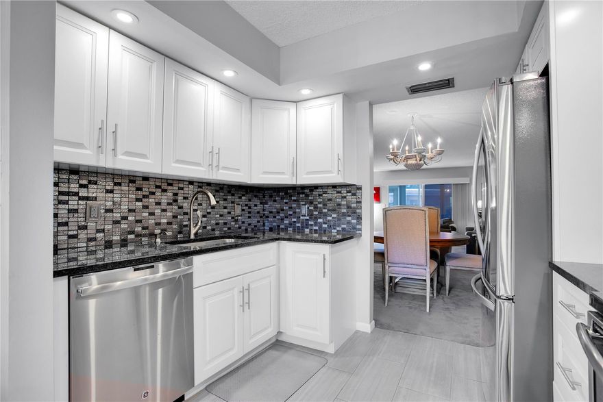 Experience the exquisite Iris Floor Plan, offering breathtaking views of the Village Pool and Lake. This stunning property features an expansive backyard that provides the perfect private outdoor oasis. The gourmet kitchen has been completely remodeled to meet modern standards, while the bathrooms have been tastefully updated with elegant new showers and cabinets. Spanning an impressive 1,350 square feet—excluding the inviting patio- this living area offers a generous space ideal for entertaining guests. The thoughtfully designed split bedroom layout ensures privacy for both you and your guests. Enjoy the convenience of an in-unit washer and dryer, and benefit from designated parking at #105. VACANT-PRIDE SERVICE AGREEMENT AVAILABLE-SEE ALL PHOTOS THEN SEE FOR YOURSELF