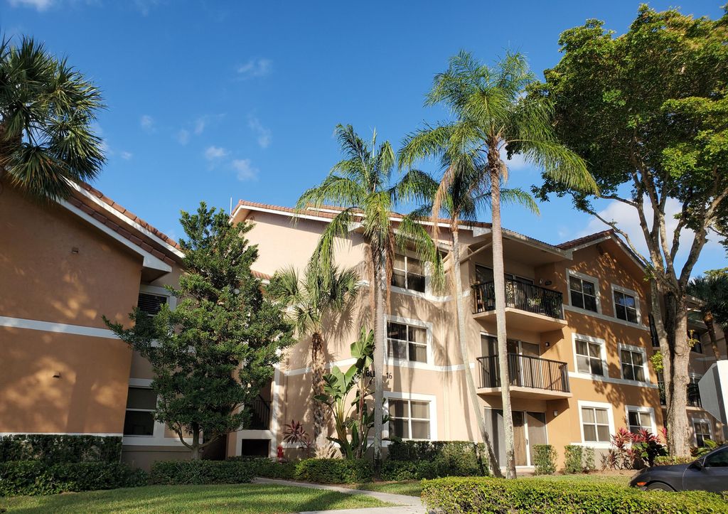 Photo of 8781 Wiles Road #202, Coral Springs, FL 33067 (MLS # B26006686)