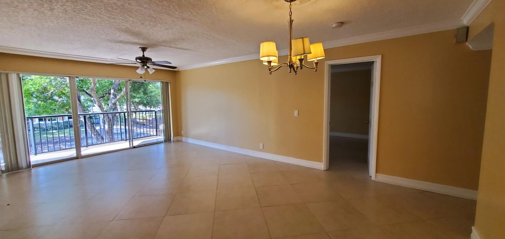 Photo of 8781 Wiles Road #202, Coral Springs, FL 33067 (MLS # B26006686)