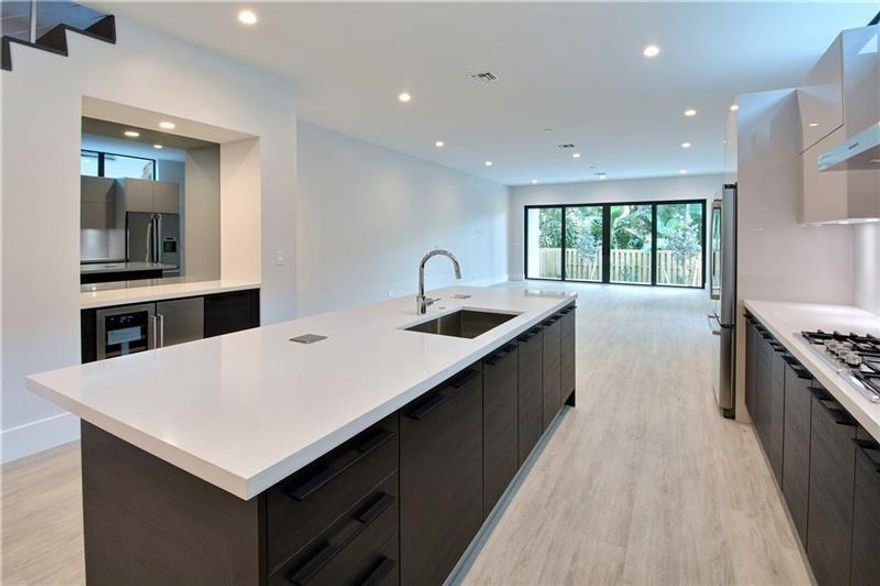 Newly-Built! Contemporary Design CORNER Townhome in East Fort Lauderdale’s Victoria Park! 3 Bedroom + Loft, 3.5 Bathroom, 2 Car Garage – Custom built in closets in ALL bedrooms, Black out roll down shades in all rooms! Walking Distance to Las Olas, Restaurants, Shopping, and more! Volume Ceilings, Open Concept Living, Stunning Finishes, Chef’s Kitchen with Bosch Appliances, Gas Cooking, Italian Cabinetry, and Separate Built-In Bar with Wine Refrigerator! Spacious Bedrooms with Custom Closet Built-In’s PLUS Loft/Optional 4th Bedroom; NO Carpet! Impact Glass Throughout, Floor to Ceiling Windows, Fenced Yard and Private Covered Outdoor Dining/Entertaining!