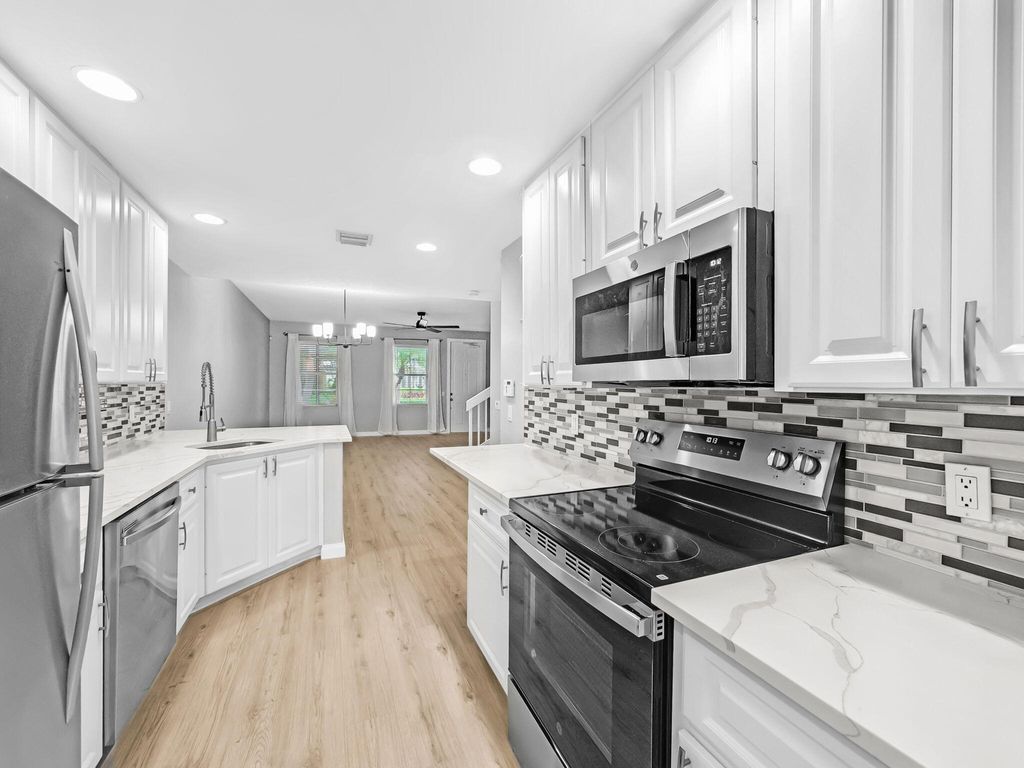 Photo of 3119 E Community Drive, Jupiter, FL 33458 (MLS # B26015099)