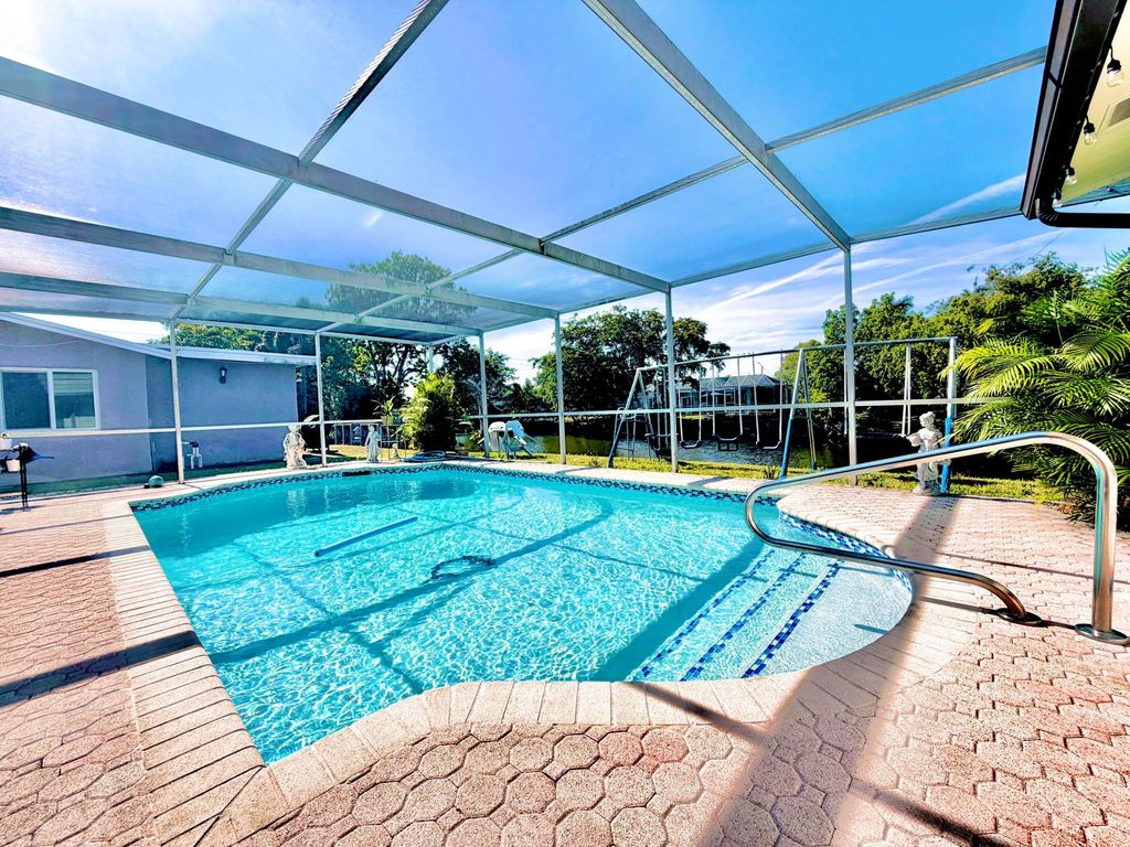 Photo of 11441 NW 29th Manor, Sunrise, FL 33323 (MLS # B26017806)