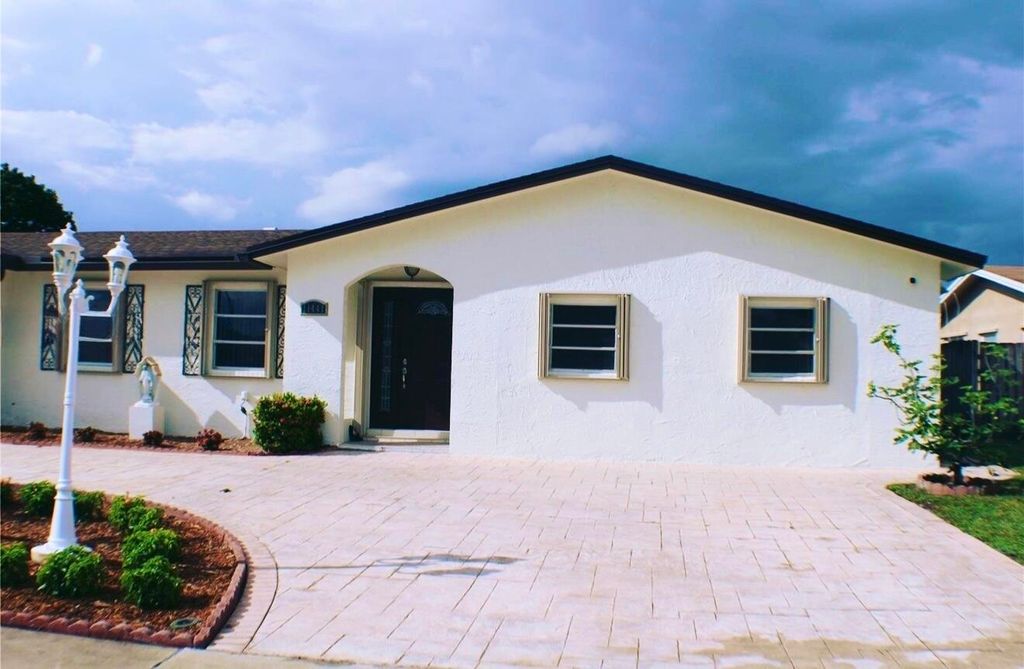 Photo of 11441 NW 29th Manor, Sunrise, FL 33323 (MLS # B26017806)