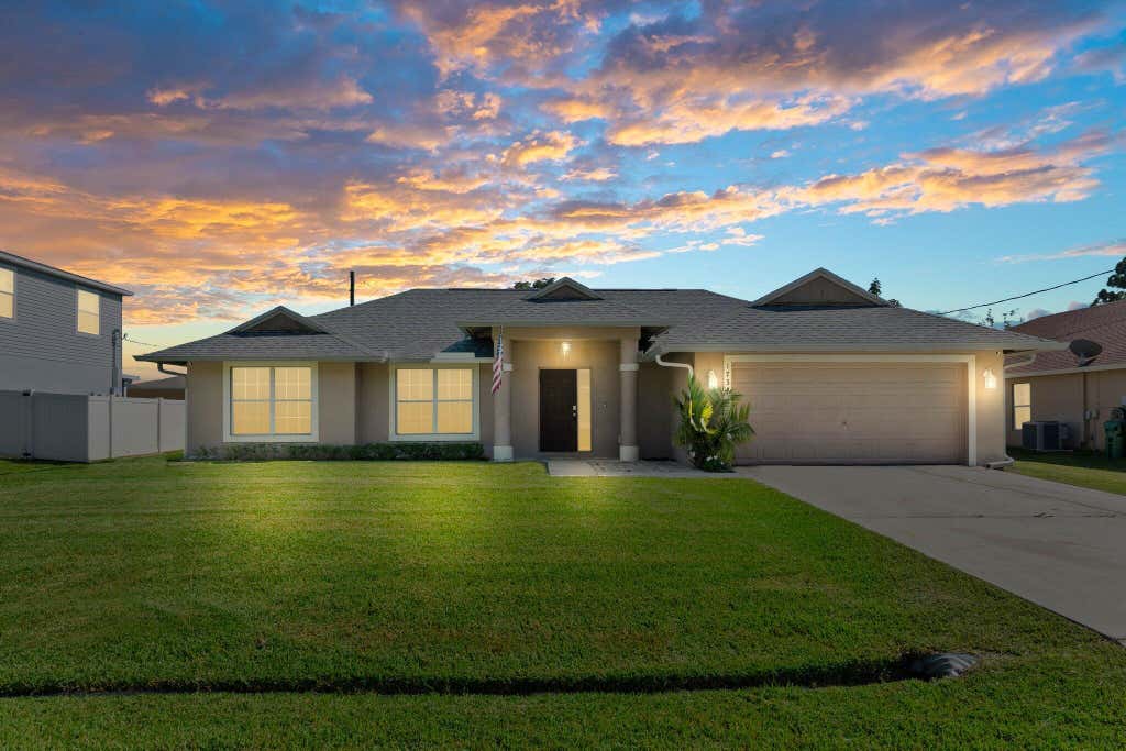 Photo of 1734 SW Capehart Avenue, Port St Lucie, FL 34953 (MLS # R10912613)