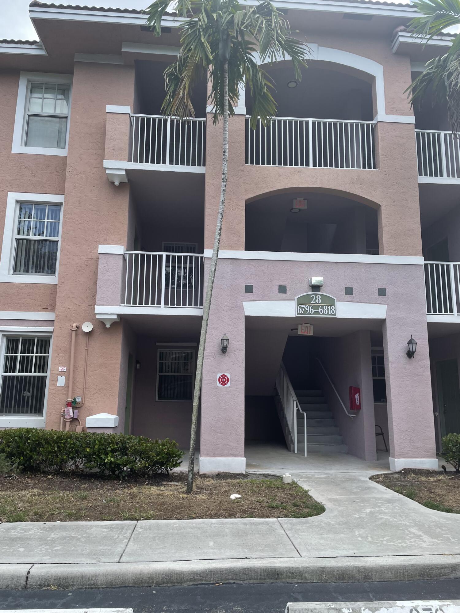 GREAT LOCATION CLOSE TO 441 AND TURNPIKE ON SAMPLE RD . VERY CLOSE TO SHOPS AND GROCERY STORES. GATED COMMUNITY . LAMINATE FLOORS .W/DRYER IN THE UNIT MARBLE VANITY AND NEW APPLIANCES QUARTZ KITCHEN COUNTERTOPS,SCREENED BALCONY AND STORAGE ROOM.HURRICANE SHUTTERS.