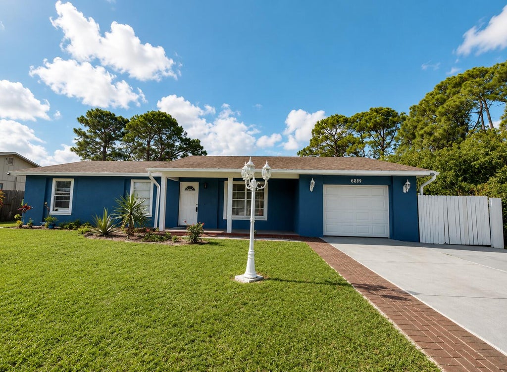 Photo of 882 SE Walters Terrace, Port Saint Lucie, FL 34983 (MLS # B26047838)