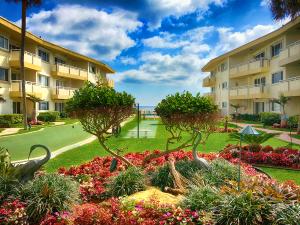 Turnkey Secluded and rare gated Condo on the beach located on Millionaire Mile. Beautiful 2/2 ground floor unit for those who don't wish to to be concerned with stairs or elevators. There are elevators in the building if needed. Located on the south side of the building with ocean access and view from your bedroom. Amazing cool cross breezes from the fresh ocean air. Enjoy the two putting greens, shuffleboard, your patio with ocean views and watch the yachts go by on the intracoastal. SOLD FURNISHED It's mainly a seasonal condo with 90% snowbirds. Over 7 Months out of the year it's your own private oasis...Will entertain ALL reasonable offers. Sellers are motivated. Willing to make concessions for carpet etc...
