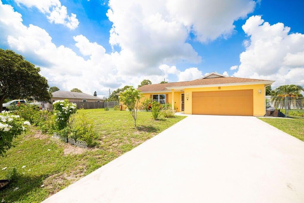 Photo of 612 SW Stillman Avenue, Port Saint Lucie, FL 34953 (MLS # R11103638)